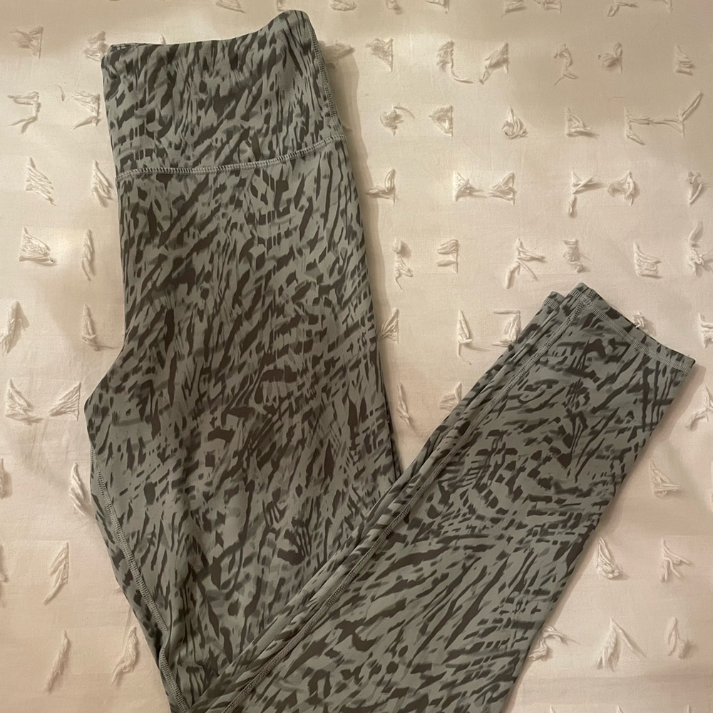 Green leggings with pattern on. Very soft like butter and super stretchy.